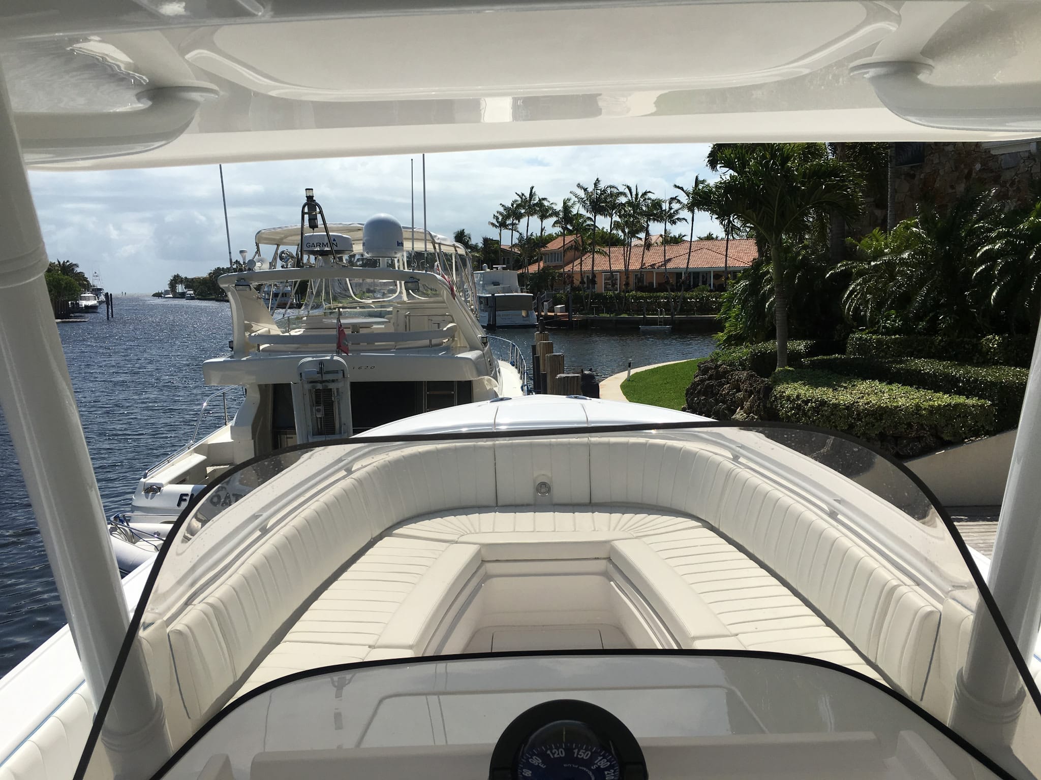 white boat cushions and bolsters upholstery  boat docked at Coral Gables