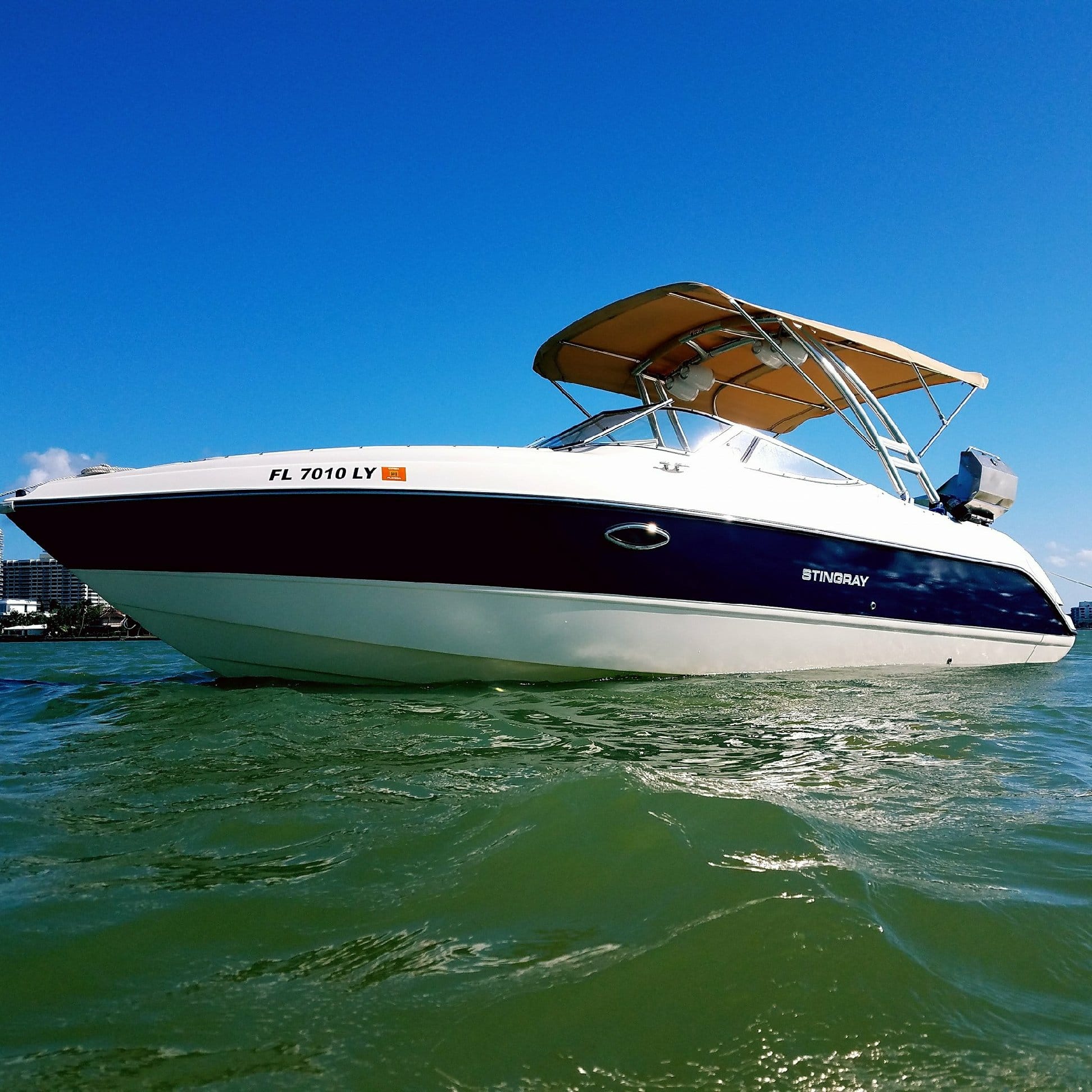 Boat in Miami with a new custom tan Bimini top canvas  